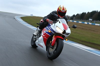 Honda's CBR600RR being tested at Donington's Craner Curve. It was slippery, but that gave us chance to test the new ABS system and forks.