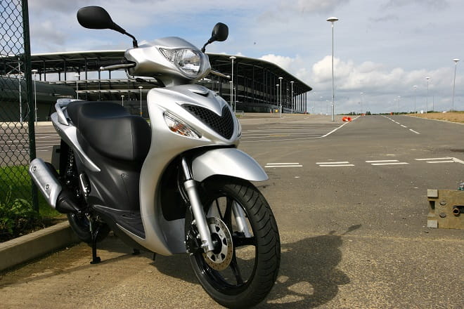 Averages 60-70mpg, nowhere near as good as more modern scoots