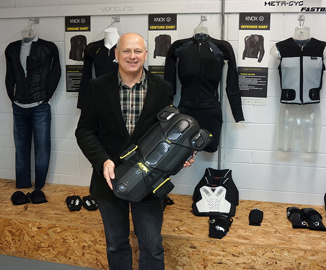 Knox founder and former racer Geoff Travell photographed at the factory with some of the clothing and protective gear that his company makes.