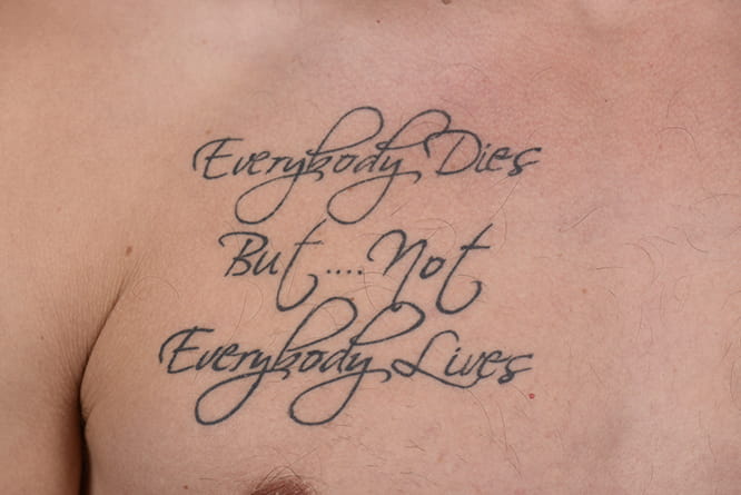 Third such motivational quote permanently etched on Redding's body