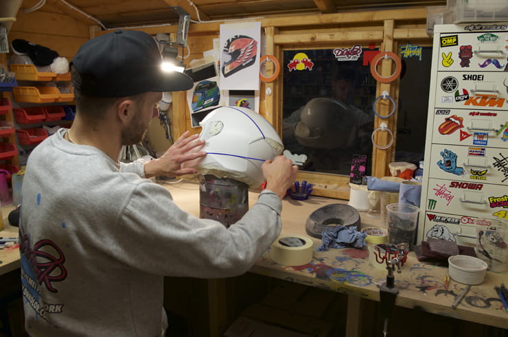 DrKolor tapes out a helmet prior to painting