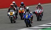 Classic MotoGP motorcycles race on a track