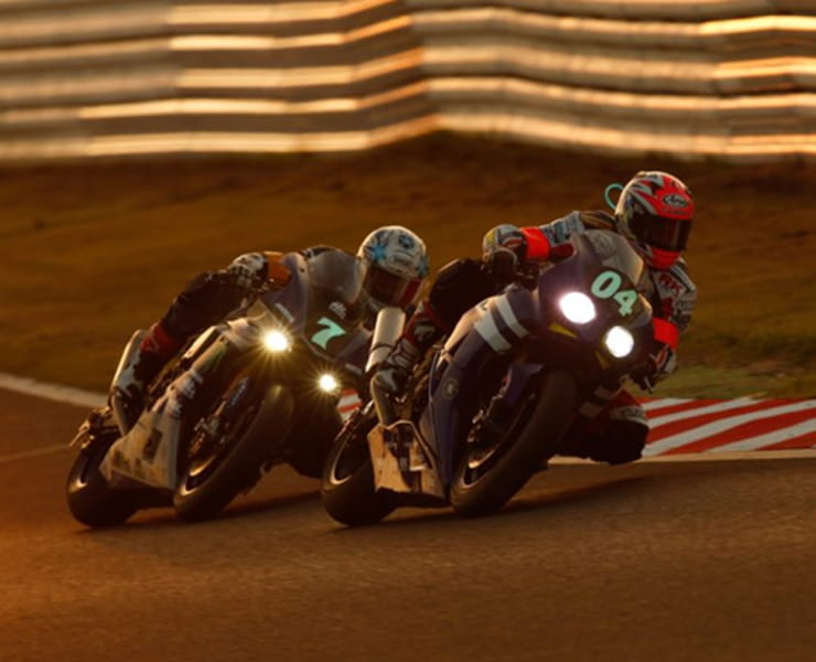 Yamaha R1M and Honda Fireblade race at dusk in the Suzuka 8 hour endurance race