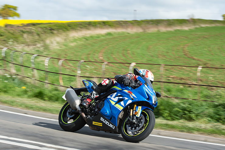 Suzuki GSXR1000RR goes quickly along a country road