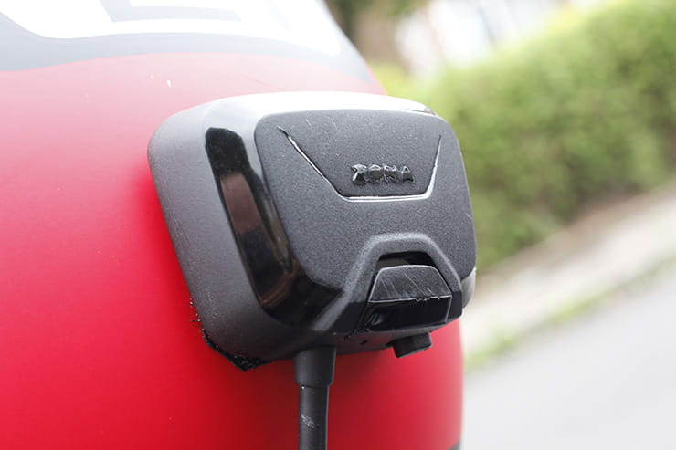The Zona rear view camera receiver mounted on a crash helmet