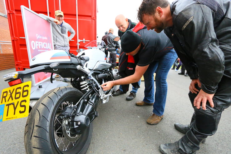The BMW 2017 R NineT Racer gets inspected by the crowds at the Manx GP