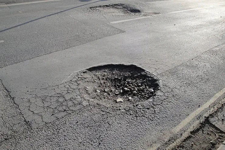 Pothole plague due to huge spending cuts_01