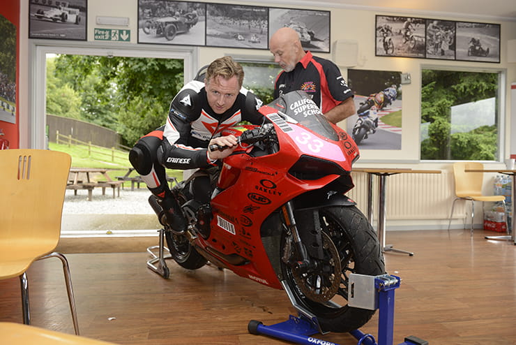 Mann learns knee-to-knee drill on a stationary 959 Panigale