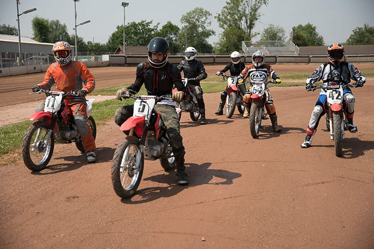 The group take to the track together to ride flat track 