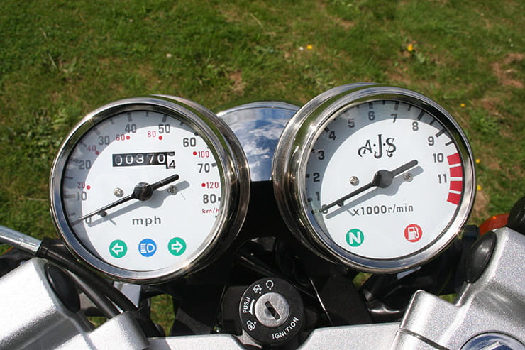 Chrome-rimmed white-faced speedo and rev counter look nice but no trip or fuel gauge