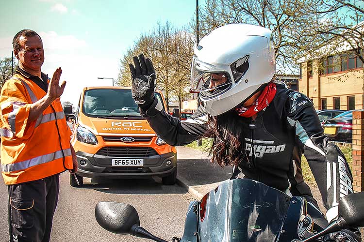 Lady on a motorbike with the RAC