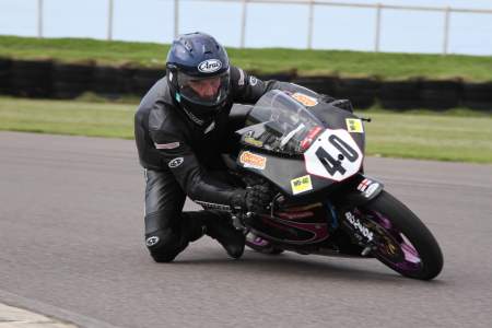 Knee down at Anglesey on Joe's RS125R