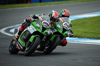 Sykes (left) wins at Donington but Rea leads the Championship
