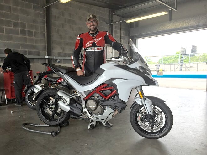 The Multistrada at Donington Park, and a beaming Potter about to cut some laps on a session.