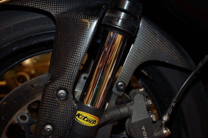 Forks must be oil tight. Leaking fork oil means an automatic fail.
