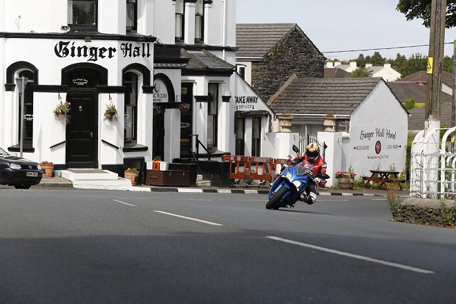 Hamming it up for the camera at Ginger Hall on the Suzuki GSX-S1000F on a lap of the TT course.