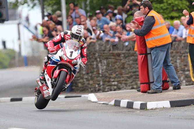 John McGuinness powers home to his 23rd TT victory in 2015