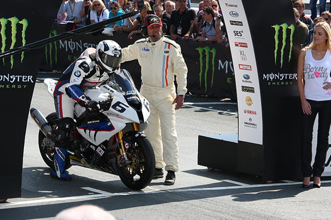 Michael Dunlop on his Dymag equipped BMW S1000RR about to set off towards another TT victory in 2014.